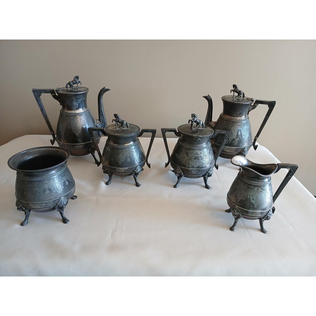 Unique Webster silver plated coffee/tea service with horse finials. 1860s-1870s. Medallion handles. Items included are...