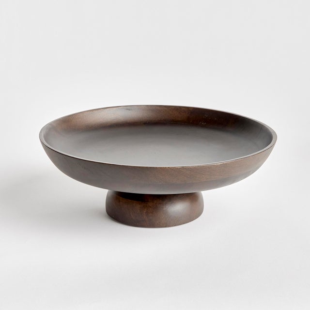 Contemporary and uniquely designed, this footed bowl is made of mango wood. Makes a beautiful serving bowl for dry foods,...
