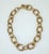 Chunky monkey! Fabulous fluted gold link chain necklace by Ralph Lauren. The chunky look is created with oval shaped...