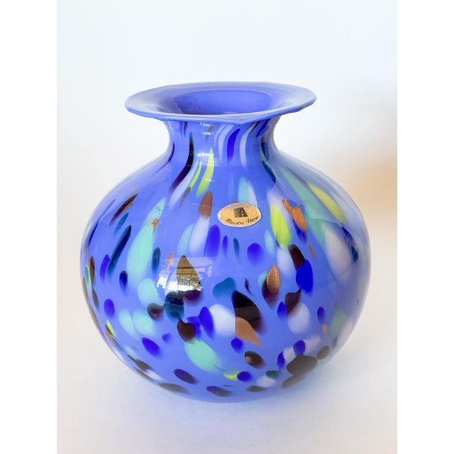 A gorgeous and vibrant piece of art glass made in Murano Italy by Azzurra Maestri Vetrai, in shades of periwinkle, copper,...