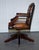 Exquisite Rare Cigar Brown Leather Chesterfield Directors Swivel Office Chair. This exquisite chair features a robust...
