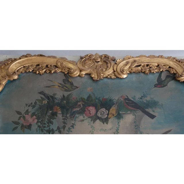 A large, stunning trumeau mirror dating back to the Louis XV period in France, c. 1760s. In typical period fashion, the...