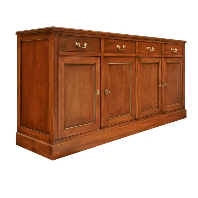 Louis XVI style buffet from France. This case piece is made of solid wood construction, primarily walnut wood. The piece...