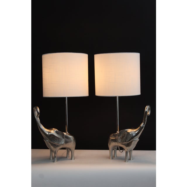 A pair of Robert Kuo influence lamps. Unique sculptural pieces. Made from hand fired. cast nickel. Each piece has it's own...