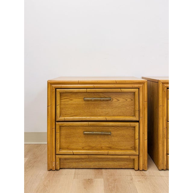 This charming pair of vintage Lea faux bamboo nightstands are a warm and stylish coastal and Hollywood Regency bedroom...