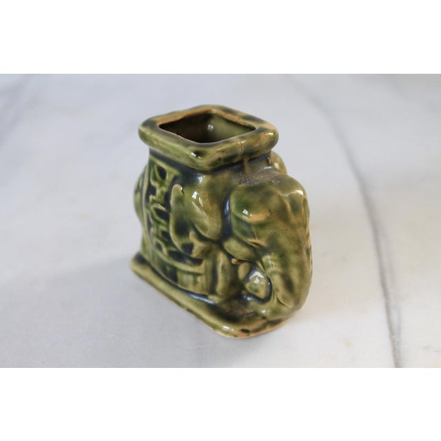 Vintage green ceramic elephant toothpick holder. No makers mark. One very small chip on the inside rim. Pictured.
