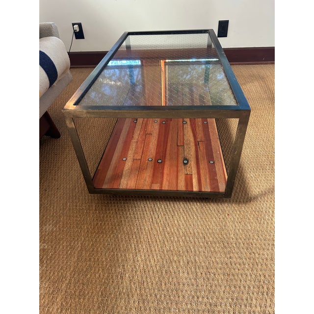 Stylish and very functional custom made industrial coffee table on casters having metal frame, chicken wire top and...