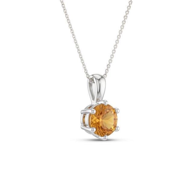 This timeless pendant showcases a radiant Citrine gemstone, celebrated for its warm golden hue and uplifting energy. Known...