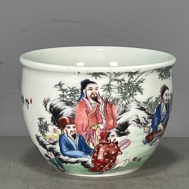 This is a charming vintage Chinese porcelain teacup , decorated in the famille rose palette with vibrant polychrome...