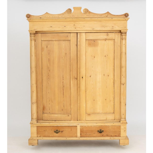 Rustic Pine Wood Wardrobe, 19th century, with the two doors opening to brass hooks, two short drawers to the base. 78.5" H...