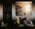 This oil on panel work captures an intimate interior scene, where a collection of objects rests on a table, partially...