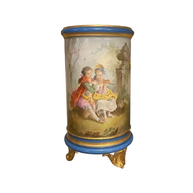 A refined pair of French Late 19th century Sèvres-style cylindrical form porcelain vases. Each piece is exquisitely hand-...