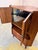 This Danish teak corner cabinet is the perfect combination of space-saving functionality and the glamorous lifestyle of...