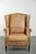 This beautiful, light-colored cowhide wingback chair has a timeless English look and offers excellent seating comfort. It...