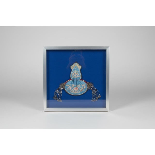 Qing Dynasty. mid 19th century, Chinese purse in frame. Elaborate bird and flower embroidery on silk with metal beading at...