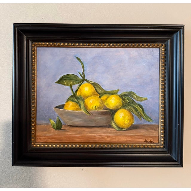 Original oil painting by Jill Pavlas of lemons in a bowl. Framed in a wood frame with gold accents. Frame size is 15.5” x...