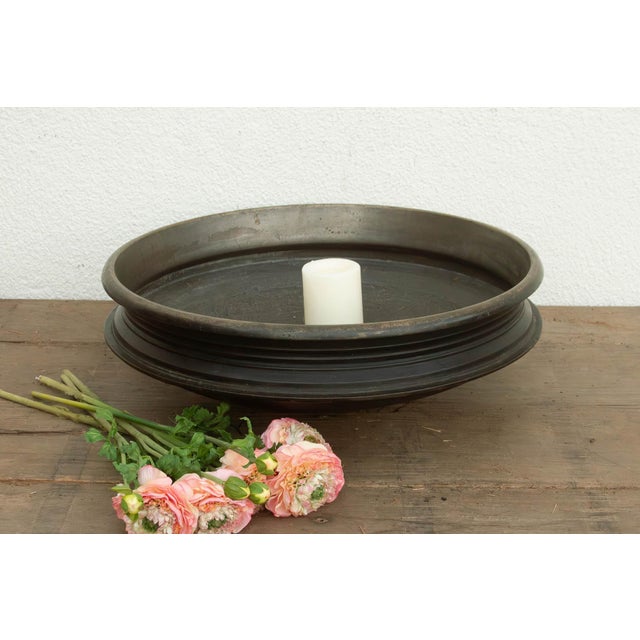 This 22.5-inch Urli is a testament to the master metalwork of Southern India, hand-cast from a particularly high-density...