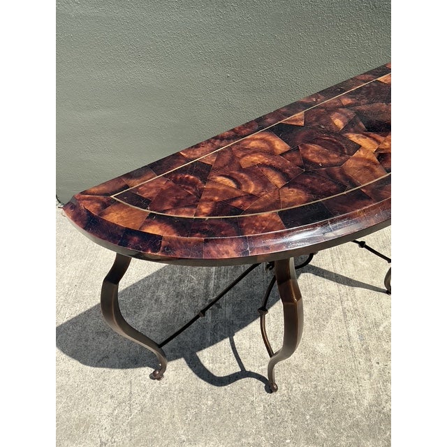 This stunning demi-lune console table by Maitland-Smith is a masterpiece of late 20th-century luxury and artisanal...