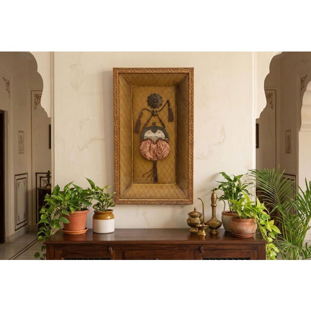 An elegant framed shadow box display featuring an antique purse or reticule. Measuring 18 inches wide and 31 inches high,...