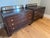 Known for their Modern Regency style, these chests feature a rich mahogany finish and a distinctive faux antiqued mirrored...