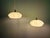 Pair of Art Deco pendant lights in light green speckled glass, 1930s. Each pendant has been rewired with a beige twisted...