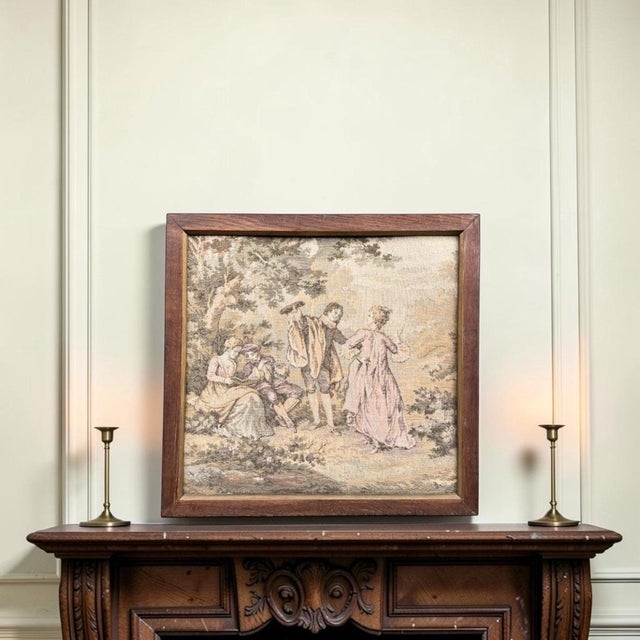This is a charming and detailed vintage framed textile, featuring a classical fête galante (courtly pastoral festival)...