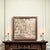 This is a charming and detailed vintage framed textile, featuring a classical fête galante (courtly pastoral festival)...