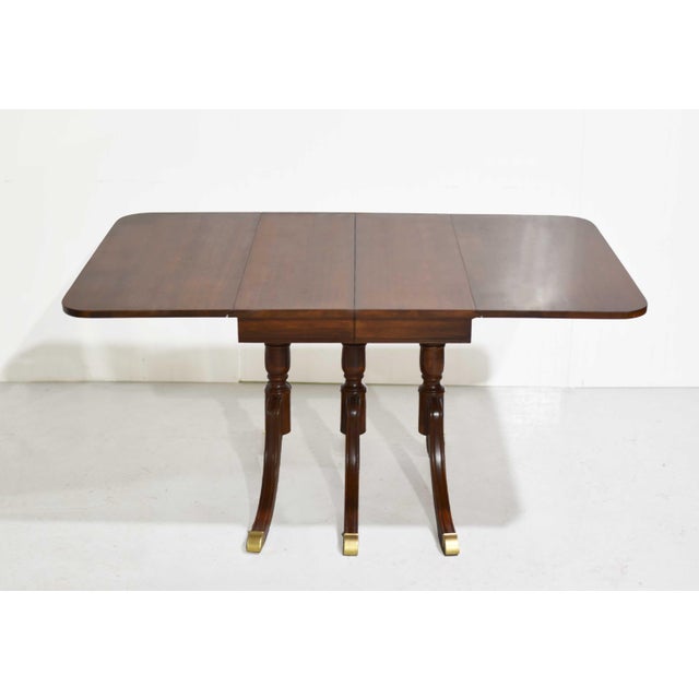 Traditional Mid Century Regency Style Mahogany Drop-Leaf Dining Table With Brass Capped Feet For Sale - Image 3 of 13