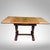 A richly figured oak draw-leaf pub table in English Jacobean Revival-Style, likely English and dating approximately to the...