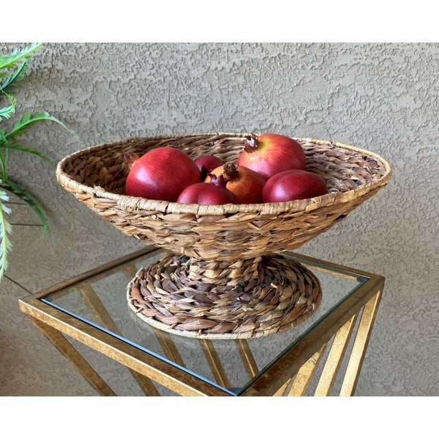 Excellent Pre-Owned Condition. Note: Faux fruit is not included. This stylish handwoven water hyacinth pedestal...