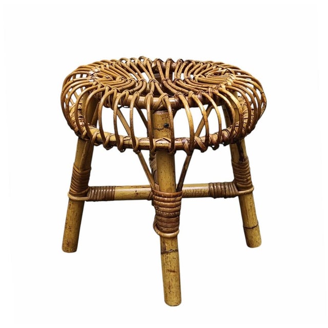 A round stool in curved rattan and bamboo from the mid-20th century, designed by Francesco Albini. Albini was among the...