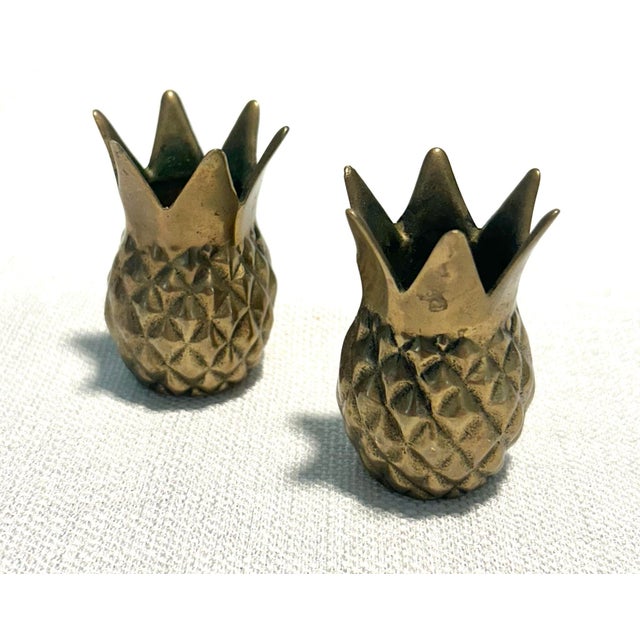 Charming Mid-Century Modern Andrea by Sadek solid brass pineapple candlestick holders featuring detailed tropical...
