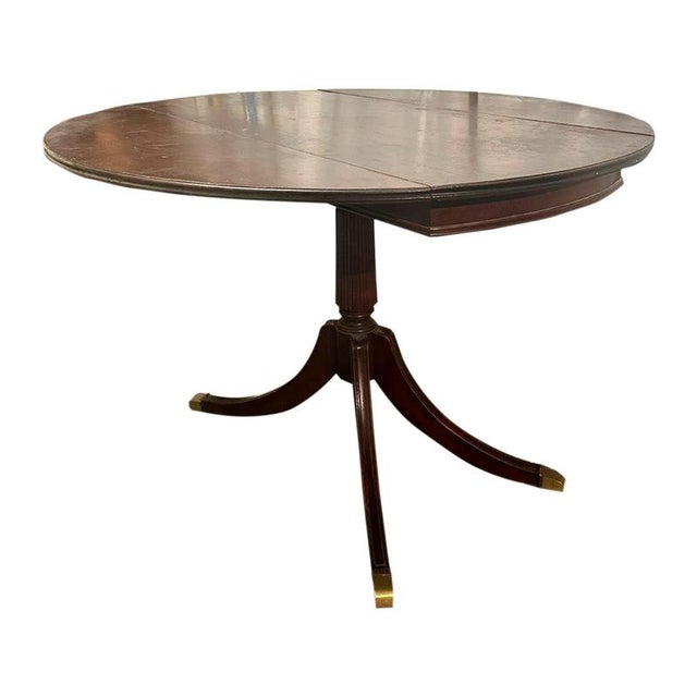 Victorian round extendable dining table. It is made of solid mahogany and consists of a central part that rests on a...