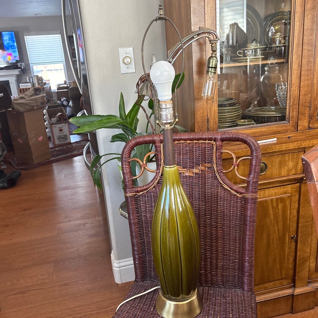 Mid Century Olive Pottery Lamp with Wooden Neck. This lamp is very nice quality. The switch is very nice circle F which...