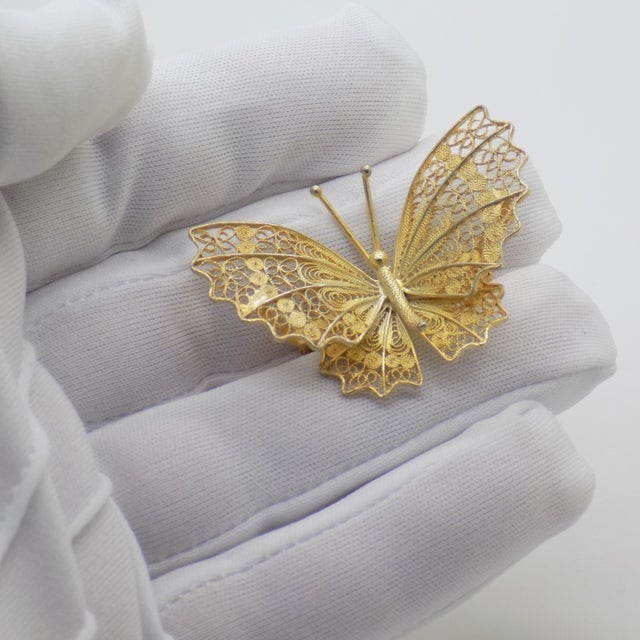 This vintage silver wearable art piece depicts a life size butterfly, crafted as a brooch pin, fashion accessory, or...