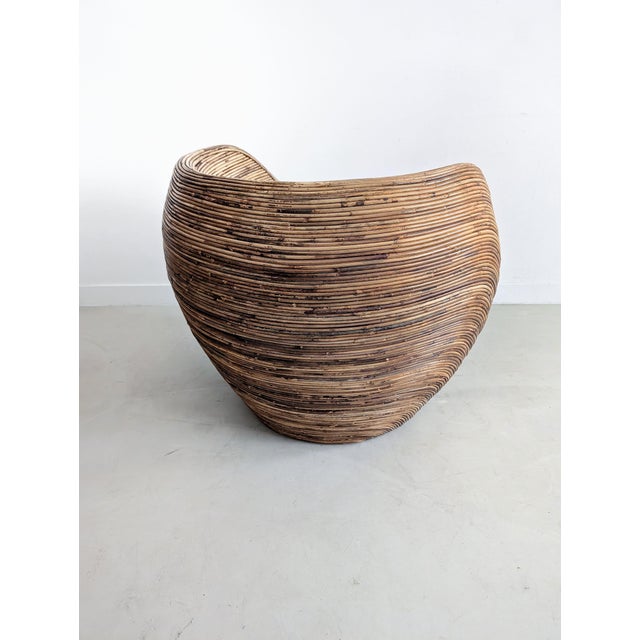 Vintage pencil reed rattan lounge chair or side chair. Model 'Sarang' by Habitat. This chair comes with a black leather...