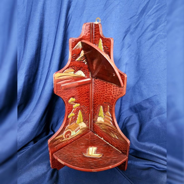 Vintage Japanese Lacquered 3 Tired Fold Out Corner Shelf. Deep red color with handpainted mountain and boat designs,...