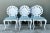 A striking set of six vintage cast aluminum shell-back grotto chairs, combining the playful fantasy of rococo revival...