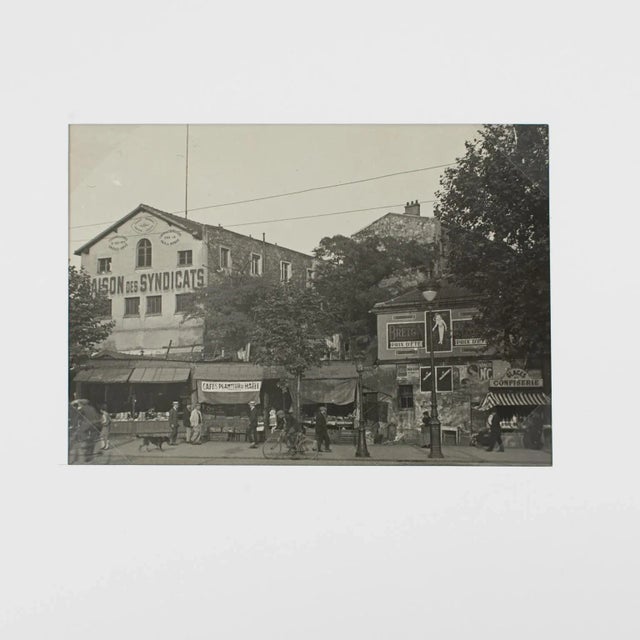 A unique original silver gelatin black and white photography. Place du Combat in Paris, France, circa 1930. A busy street...