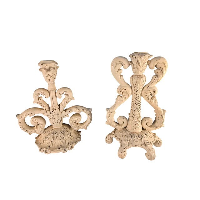 A dramatic coordinating pair of vintage Rococo Revival candlesticks featuring elaborate scrolling acanthus foliage,...