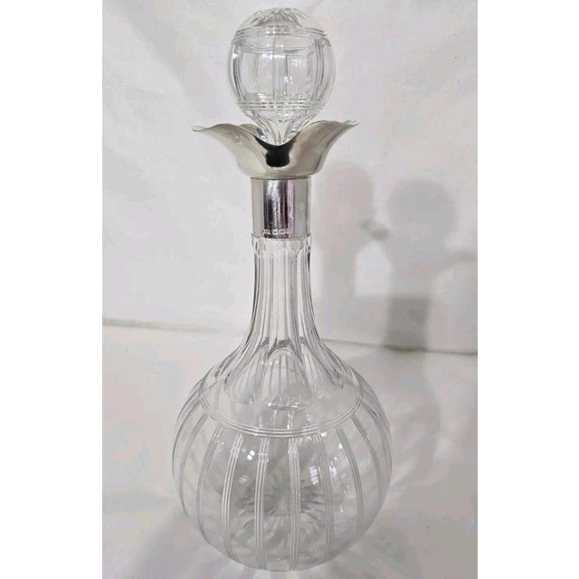A fine George V period cut glass spirit decanter dating to 1924, combining an elegant baluster-form body with a finely...
