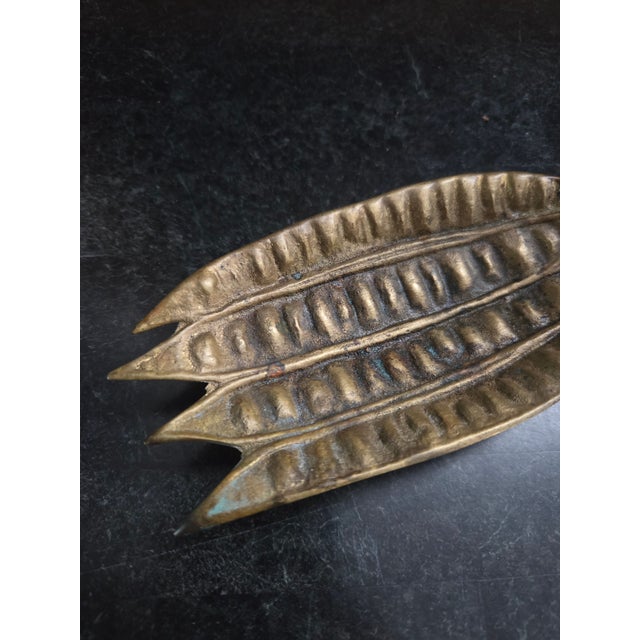 This vintage brass trinket dish by Oskar J.W. Hansen captures the essence of mid-century biomorphic design, modeled after...