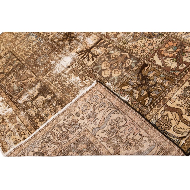 Beautiful Vintage Distressed hand-knotted wool rug with a beige field. This rug has blue and yellow accents all-over a...