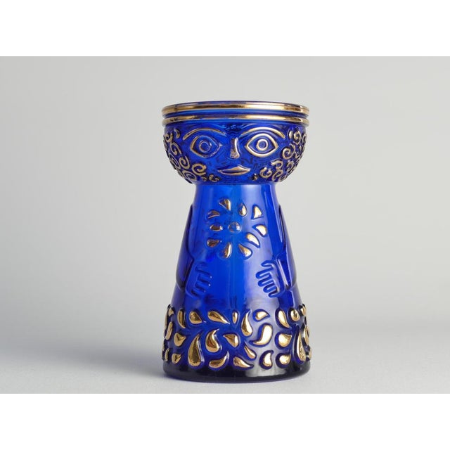 This mid-century modern cobalt blue vase with gold accents, this enchanting hyacinth vase originates from the 1970s and is...