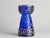 This mid-century modern cobalt blue vase with gold accents, this enchanting hyacinth vase originates from the 1970s and is...