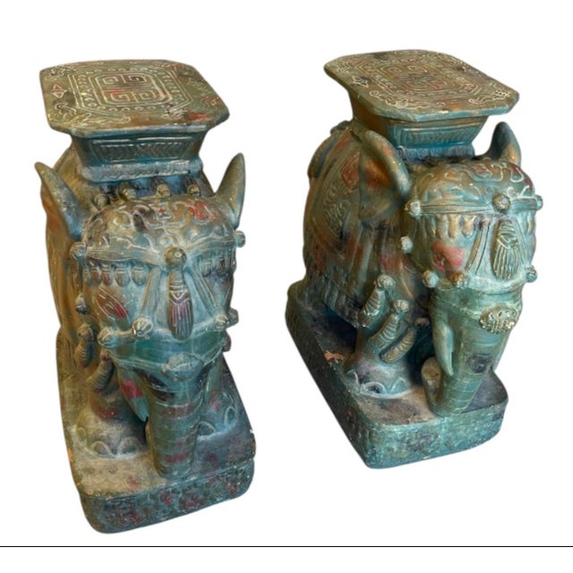 This stunning pair of vintage ceramic garden seats features majestic elephants standing proudly on rectangular plinth...