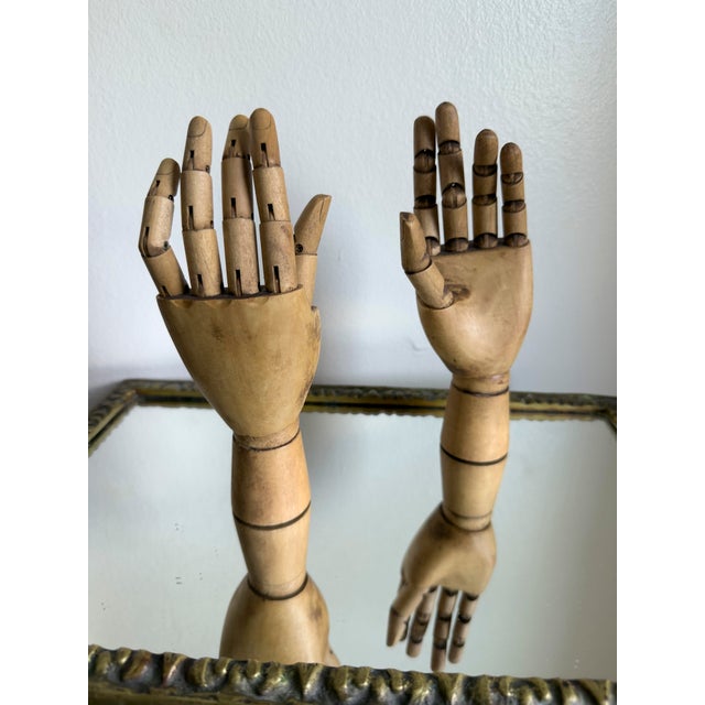 Vintage articulated wooden artist mannequin hand featuring fully jointed fingers, thumb, and knuckle segments designed for...