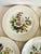 This elegant set of seven fine porcelain dessert/luncheon plates was produced by JKW (Jaeger & Co.) in Western Germany in...