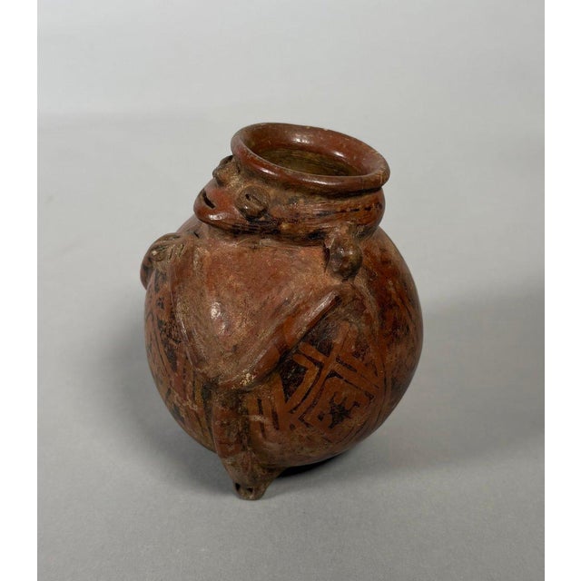 Quimbaya culture, Colombia, Central Cauca Valley. Circa 500-1500 AD. Jar-shaped vase in the form of a seated...