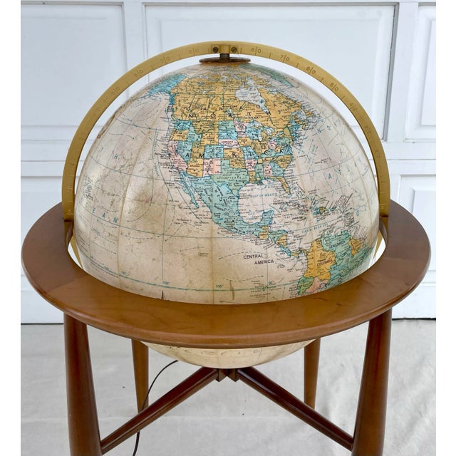 Here is an exceptional vintage globe that features a mid-century modern inspired base with illuminated 20" globe. I love...